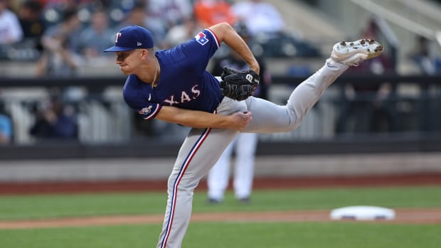 Jul 1, 2022; New York City, New York, USA; Texas Rangers starting pitcher Glenn Otto (49) delivers a pitch during the first inning against the New York Mets at Citi Field. Mandatory Credit: Vincent Carchietta-USA TODAY Sports